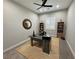 Bright office featuring a modern wood desk, stylish shelves and a striking mirror at 2891 S Rainbow Ave, Pahrump, NV 89048
