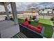 Cozy patio featuring stylish outdoor seating on artificial turf, perfect for relaxing and enjoying the outdoor space at 2891 S Rainbow Ave, Pahrump, NV 89048