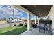 Expansive covered patio and outdoor area with a recreational vehicle and outdoor seating at 2891 S Rainbow Ave, Pahrump, NV 89048
