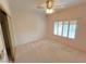 Bedroom featuring neutral walls, carpet, plantation shutters, and a ceiling fan at 2925 Big Green Ln, Las Vegas, NV 89134