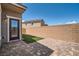 Paver stone patio with small patch of artificial turf in a walled backyard at 363 Silva Pl, Henderson, NV 89011