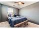 Inviting bedroom featuring a rustic wood bed, plush carpet, and large windows at 363 Silva Pl, Henderson, NV 89011