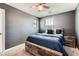 Comfortable bedroom with rustic wood bed frame, plush carpet, and natural light from the windows at 363 Silva Pl, Henderson, NV 89011