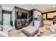 Open living room area with comfortable seating, media center, and an open floor plan at 363 Silva Pl, Henderson, NV 89011