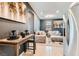 Open-concept living room featuring modern decor, neutral tones, and stainless steel appliances at 363 Silva Pl, Henderson, NV 89011