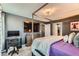 Main bedroom featuring a four poster bed frame, carpet floors, and a ceiling fan with modern light fixture at 363 Silva Pl, Henderson, NV 89011
