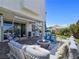 Expansive back patio with stylish seating, a fire pit, and an outdoor dining area, ideal for gatherings at 396 Blackstone River Ave, Las Vegas, NV 89148