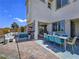 Outdoor patio with dining and seating areas, perfect for entertaining guests at 396 Blackstone River Ave, Las Vegas, NV 89148