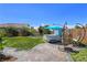 Beautiful backyard with a hot tub, seating and a well-maintained lawn at 396 Blackstone River Ave, Las Vegas, NV 89148