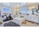Bright bathroom features a soaking tub, double vanities, and a Peloton exercise bike at 396 Blackstone River Ave, Las Vegas, NV 89148