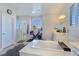 Bright bathroom features a soaking tub, double vanities, and a glass-enclosed shower at 396 Blackstone River Ave, Las Vegas, NV 89148