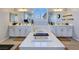 Bathroom with a large soaking tub between two vanities, perfect for relaxation at 396 Blackstone River Ave, Las Vegas, NV 89148