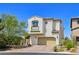A charming two-story home with a terracotta tile roof, a two-car garage, and neat landscaping at 396 Blackstone River Ave, Las Vegas, NV 89148