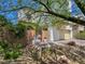Two-story home with lush greenery, gated stone fence, two car garage and desert landscaping at 396 Blackstone River Ave, Las Vegas, NV 89148