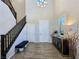 The foyer has soaring ceilings, a staircase with dark wood banisters, and modern decor at 396 Blackstone River Ave, Las Vegas, NV 89148