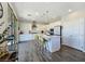 Contemporary kitchen featuring an island with bar seating and modern appliances, all in a bright, open space at 396 Blackstone River Ave, Las Vegas, NV 89148