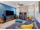 Cozy living room with comfortable seating, stylish accents, and ample natural light at 396 Blackstone River Ave, Las Vegas, NV 89148