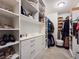 Walk-in closet with custom shelves, drawers, and hanging storage; keeping everything organized at 396 Blackstone River Ave, Las Vegas, NV 89148