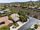 Expansive aerial view of a charming community with lush landscaping and mountain views at 42 Glade Water Dr, Henderson, NV 89052