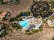 A view of community pool, clubhouse, parking, and recreational areas at 42 Glade Water Dr, Henderson, NV 89052