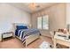 Cozy bedroom featuring carpet flooring, white wood bed frame, and desk with ample natural light at 42 Glade Water Dr, Henderson, NV 89052