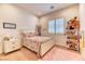 Bright ' bedroom features a playful design with a colorful bed, and a cute stuffed animals display at 42 Glade Water Dr, Henderson, NV 89052