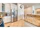 Bright kitchen boasts granite countertops, stainless steel appliances, and white cabinetry at 42 Glade Water Dr, Henderson, NV 89052