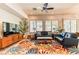 Comfortable living room with a vibrant rug, stylish furnishings, and large windows for plenty of light at 42 Glade Water Dr, Henderson, NV 89052