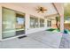 An airy covered patio featuring a ceiling fan and large sliding glass doors for seamless indoor-outdoor living at 42 Glade Water Dr, Henderson, NV 89052