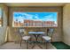 Open-air balcony with seating and a view of community buildings and blue sky at 4200 S Valley View Blvd # 2009, Las Vegas, NV 89103