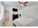 Bedroom featuring wood floors, a ceiling fan, and closet access for optimal storage at 4200 S Valley View Blvd # 2009, Las Vegas, NV 89103