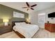 Bright bedroom with wood floors, a ceiling fan, and a large window for natural light at 4200 S Valley View Blvd # 2009, Las Vegas, NV 89103