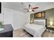 Stylish bedroom with wood floors, olive green accent wall, and modern decor at 4200 S Valley View Blvd # 2009, Las Vegas, NV 89103
