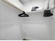 Spacious walk-in closet with ample storage space and wooden rod for organizing clothes at 4200 S Valley View Blvd # 2009, Las Vegas, NV 89103