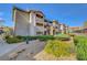 Condo complex exterior features well-maintained landscaping, multiple levels and stairs to upper units at 4200 S Valley View Blvd # 2009, Las Vegas, NV 89103