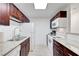 Bright kitchen with white appliances, granite countertops and overhead lighting at 4200 S Valley View Blvd # 2009, Las Vegas, NV 89103