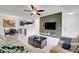 Open floor plan with a living room, dining area, and kitchen featuring modern lighting and fixtures at 4200 S Valley View Blvd # 2009, Las Vegas, NV 89103
