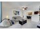 Living room features a ceiling fan, couch, coffee table and an open space to the dinning area at 4200 S Valley View Blvd # 2009, Las Vegas, NV 89103