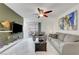 Living room features marble floors, modern fan, and sliding door access to an outdoor balcony at 4200 S Valley View Blvd # 2009, Las Vegas, NV 89103
