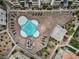 Aerial view of a uniquely shaped community pool with lounge chairs and lush landscaping at 4200 S Valley View Blvd # 3074, Las Vegas, NV 89103