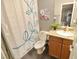 Bathroom featuring a shower with a modern curtain and a granite countertop at 4200 S Valley View Blvd # 3074, Las Vegas, NV 89103