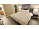 Inviting bedroom featuring wood-look floors, neutral paint and a king-sized bed at 4200 S Valley View Blvd # 3074, Las Vegas, NV 89103