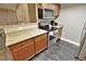 Bright kitchen features granite counters, stainless appliances, and wood cabinets at 4200 S Valley View Blvd # 3074, Las Vegas, NV 89103