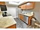 Well-lit kitchen with granite countertops, wood cabinetry and stainless steel appliances at 4200 S Valley View Blvd # 3074, Las Vegas, NV 89103
