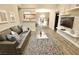 Open-concept living room with modern decor, comfortable seating, and a view of the dining area and kitchen at 4200 S Valley View Blvd # 3074, Las Vegas, NV 89103