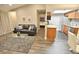 Living room open to the kitchen area, with a comfortable sofa and modern furnishings at 4200 S Valley View Blvd # 3074, Las Vegas, NV 89103