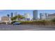 Street view of parking lot with a blue SUV and city buildings visible in the background at 4200 S Valley View Blvd # 3074, Las Vegas, NV 89103