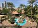 Resort-style pool area features a stunning rock waterfall, lush landscaping, and inviting lounge areas at 4200 S Valley View Blvd # 3074, Las Vegas, NV 89103