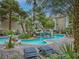 Resort-style pool and tanning area, surrounded by lush landscaping for a tranquil outdoor experience at 4200 S Valley View Blvd # 3074, Las Vegas, NV 89103