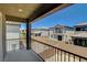 View from a balcony of a community with two-story homes, block walls, and desert landscaping at 4240 Spring Storm Ave, North Las Vegas, NV 89081